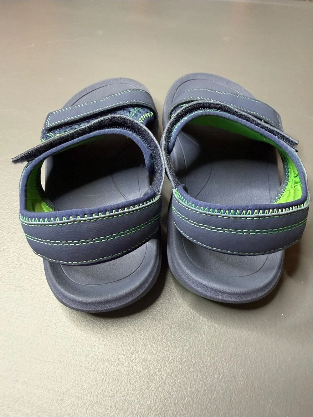 Kid’s Teva Navy and Bright Green Hook-and-Loop Sandals. Size: 2.